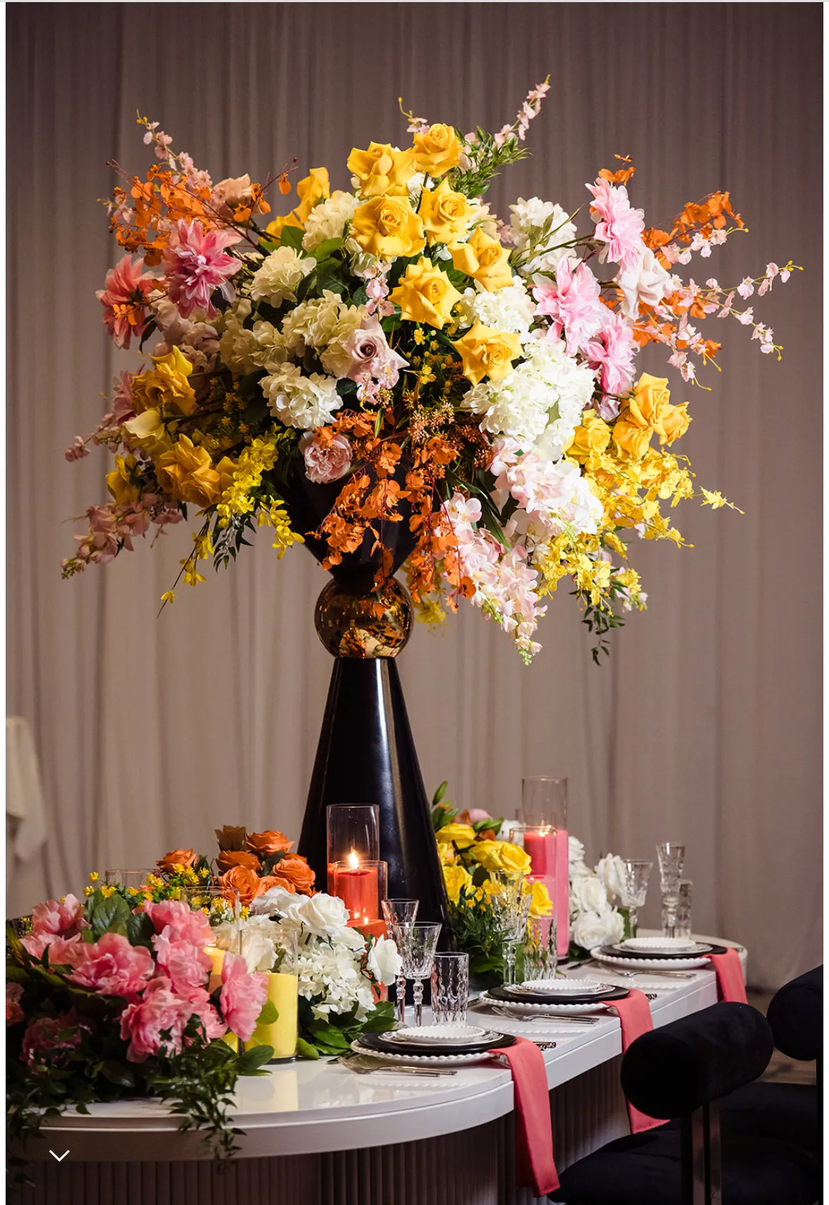 Pink and orange floral arch by Greystone