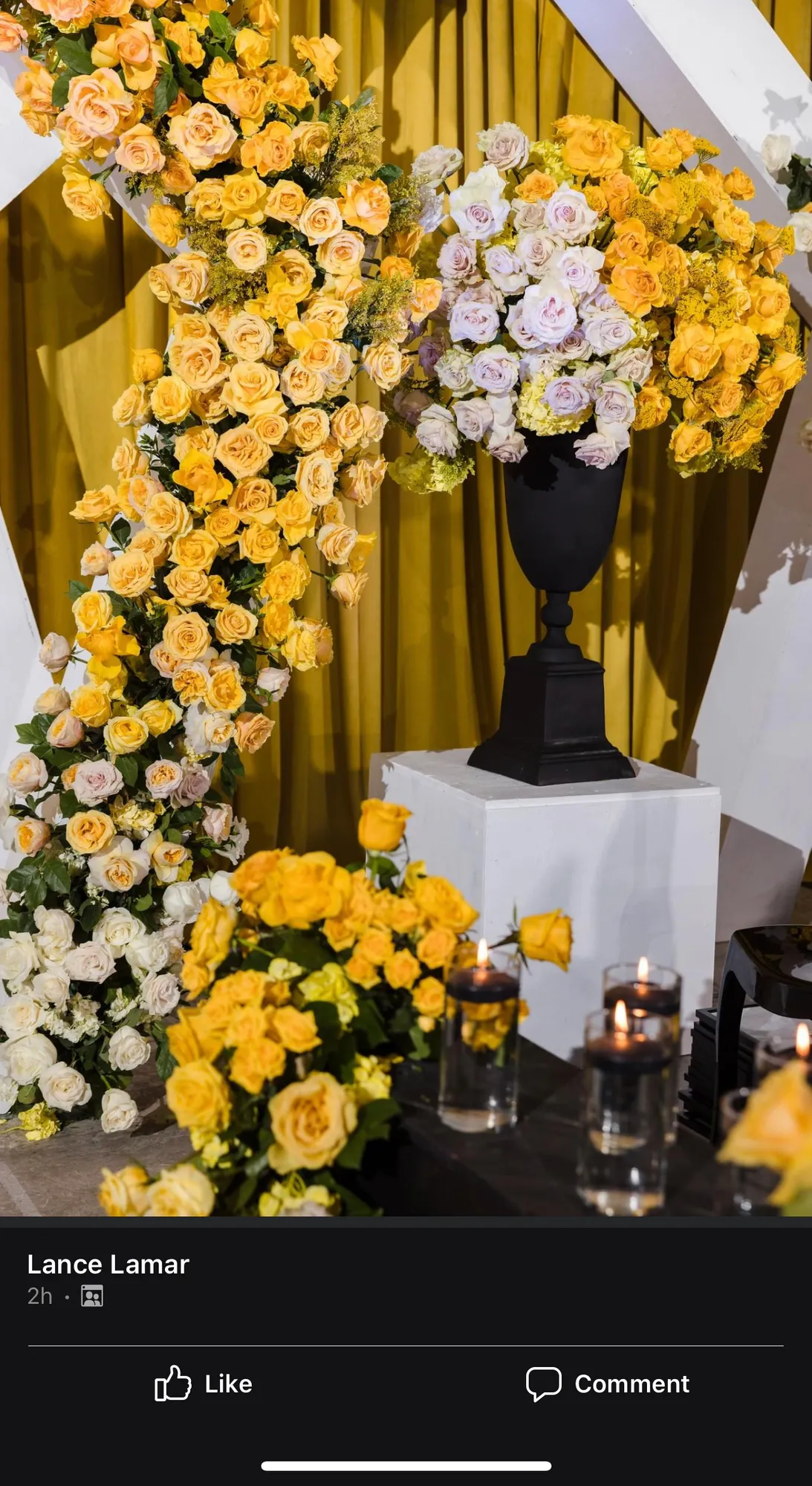 Floral arrangement in a gold vase by Greystone