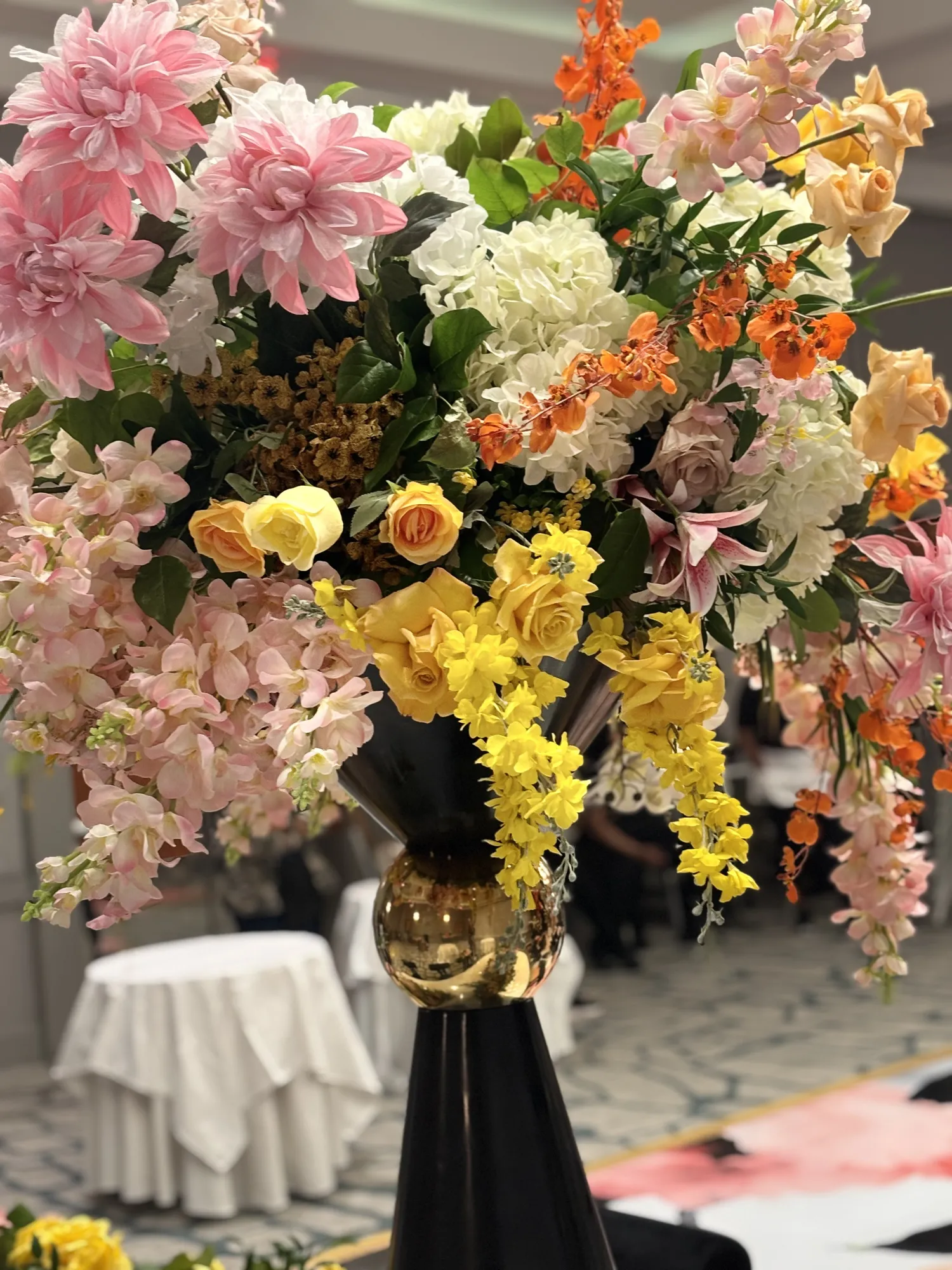 Orange and pink floral arrangement by Greystone