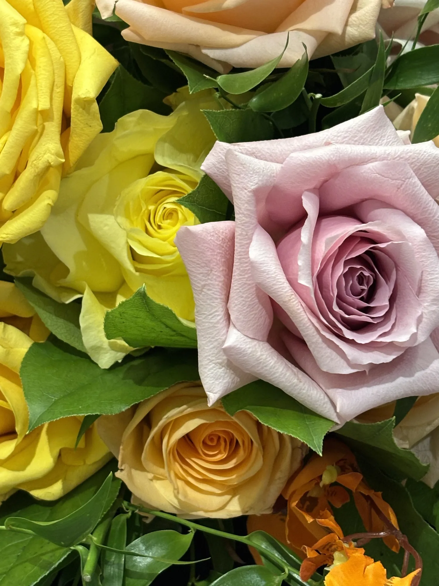 Pink and yellow floral arrangement by Greystone