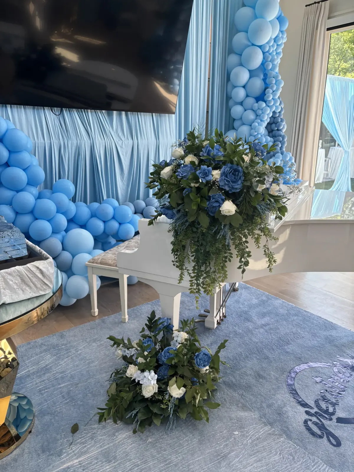 Balloon and floral ceremony backdrop being installed by Greystone
