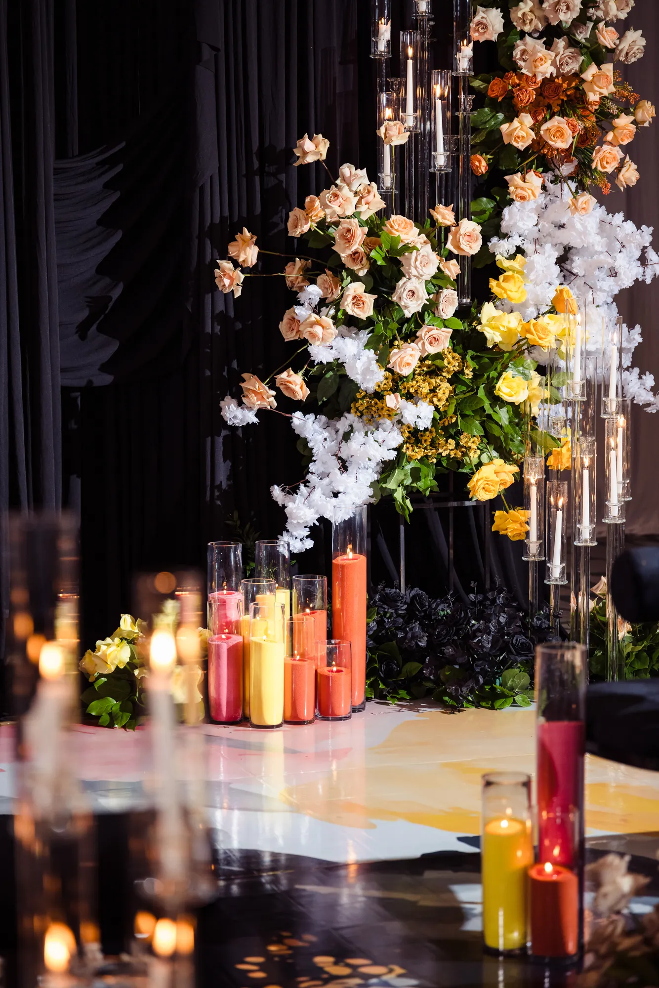 Detail of a candlelit floral wall with peach and white roses by Greystone