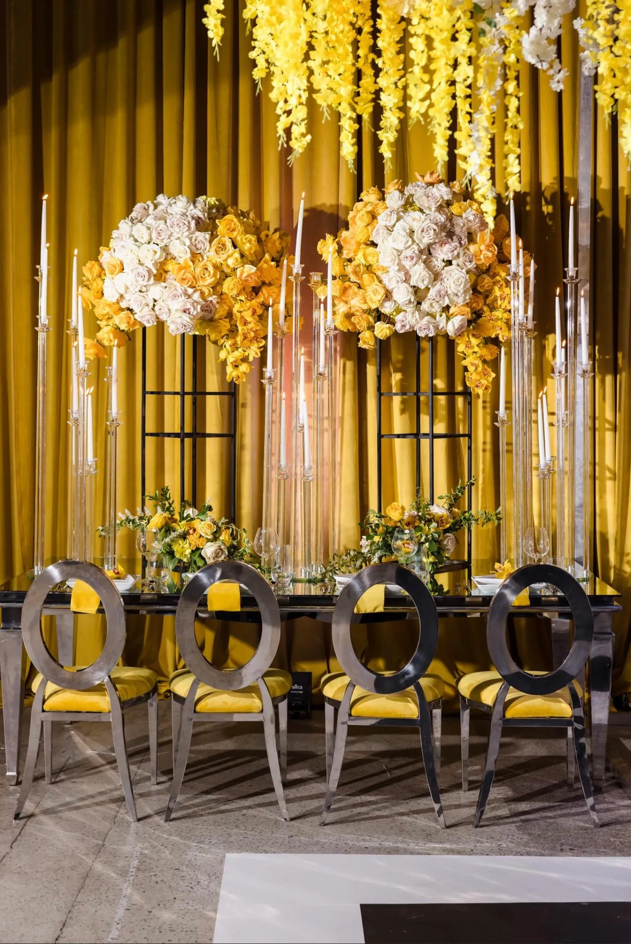 Reception tables with gold chiavari chairs by Greystone