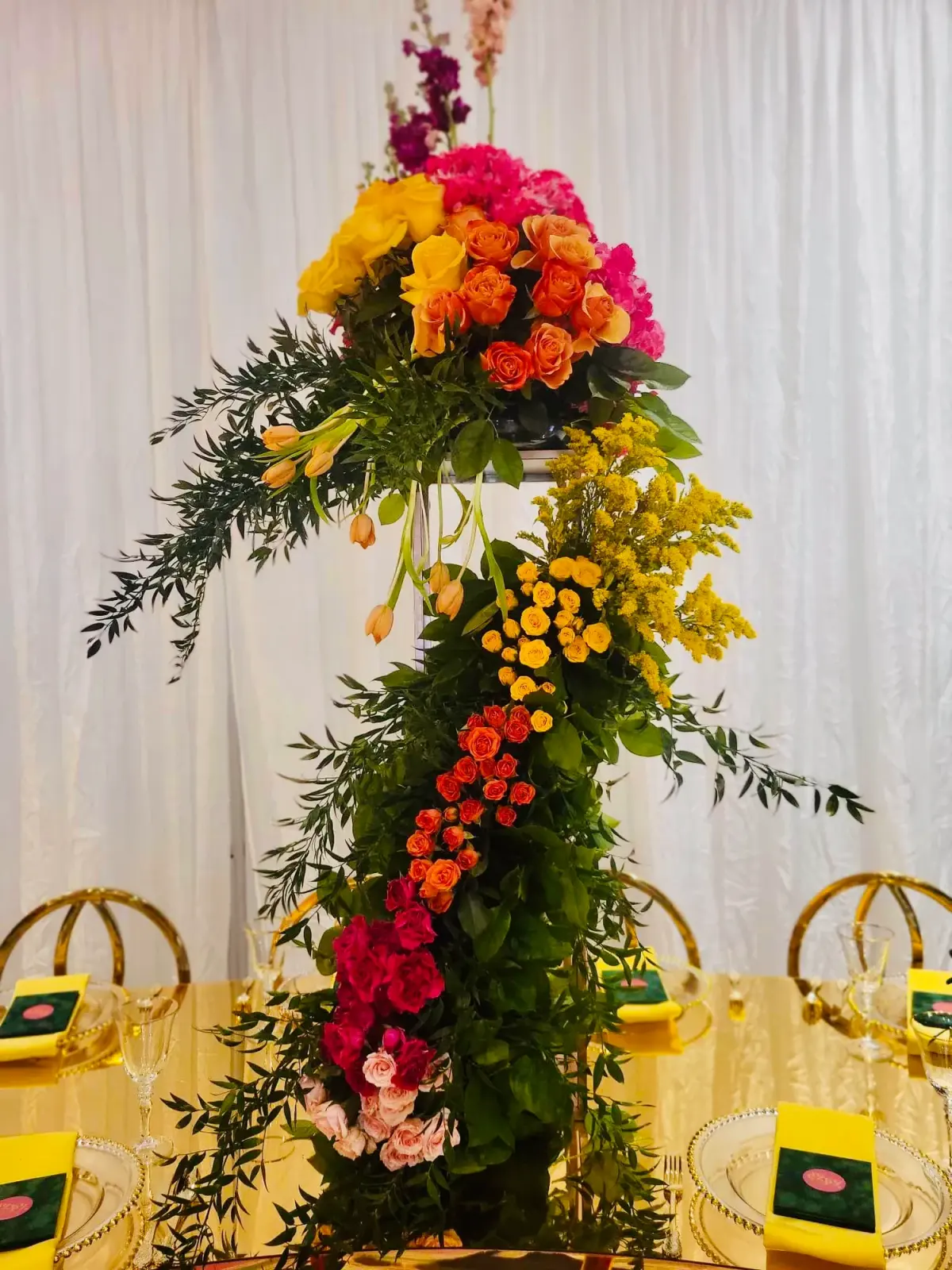 A red and pink floral tower designed as a statement piece by Greystone