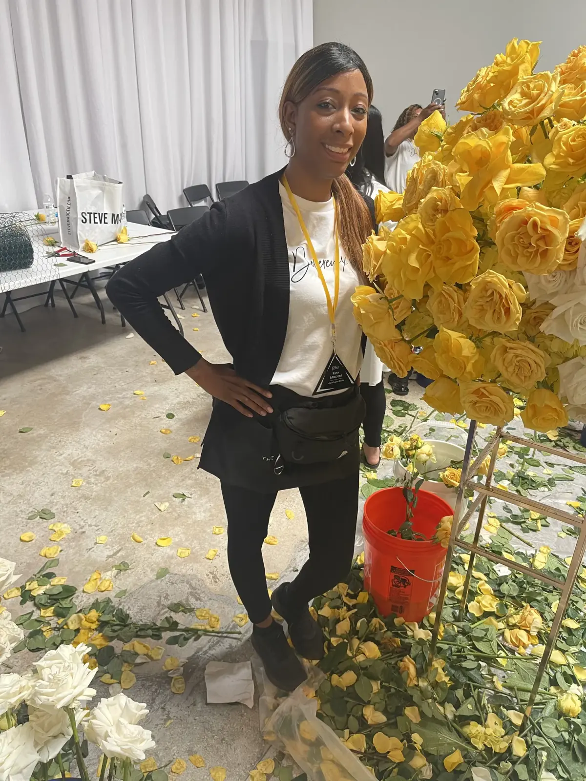 Keya Mociers beside a Greystone rose arrangement